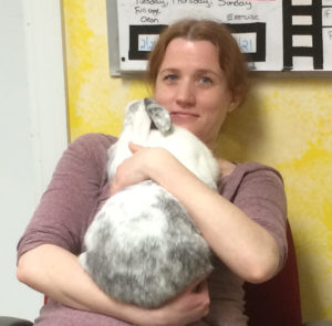 Shelter volunteer Sadie MacMillan cuddles a bun. Photo courtesy of Stacey Paiva.